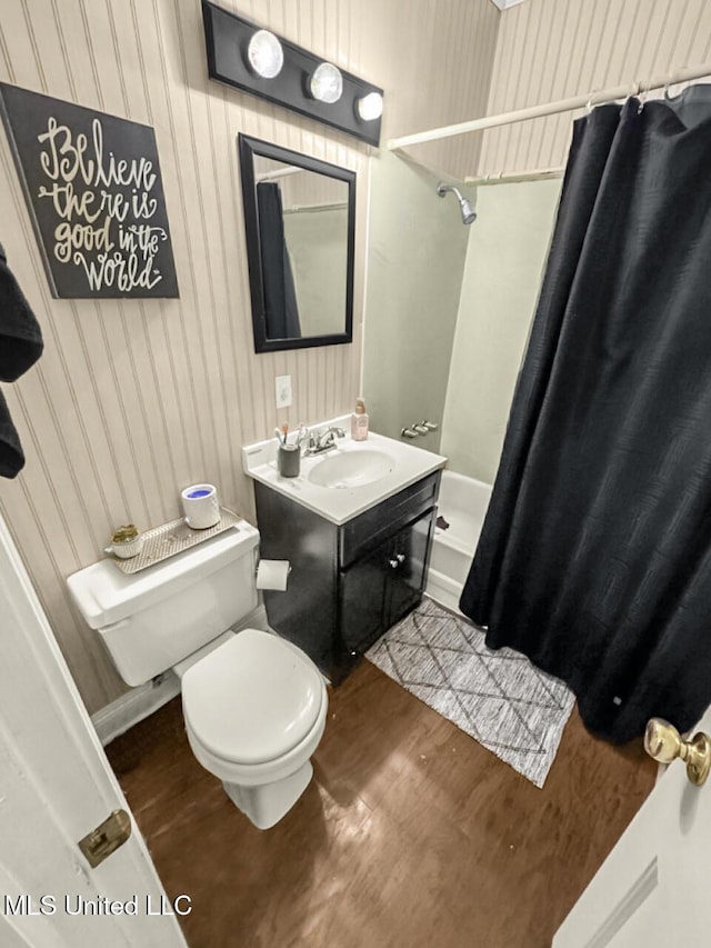 903 Kenwood Ln, Natchez, MS 39120 - full bathroom featuring hardwood / wood-style flooring, vanity, shower / bath combination with curtain, and toilet