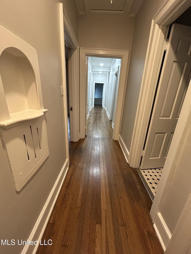 341 N Ruby Ave, Ruleville, MS 38771 - hall featuring dark wood-type flooring and baseboards