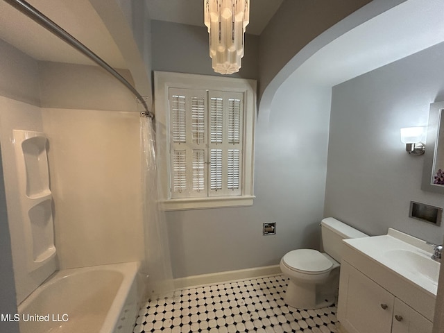 341 N Ruby Ave, Ruleville, MS 38771 - bathroom with baseboards, toilet, tile patterned floors, vanity, and shower / bath combination with curtain