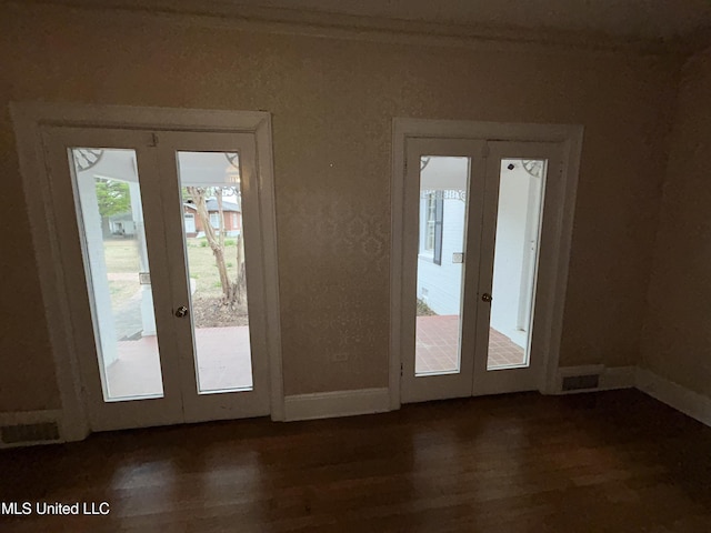 341 N Ruby Ave, Ruleville, MS 38771 - doorway featuring baseboards, french doors, and dark wood-type flooring