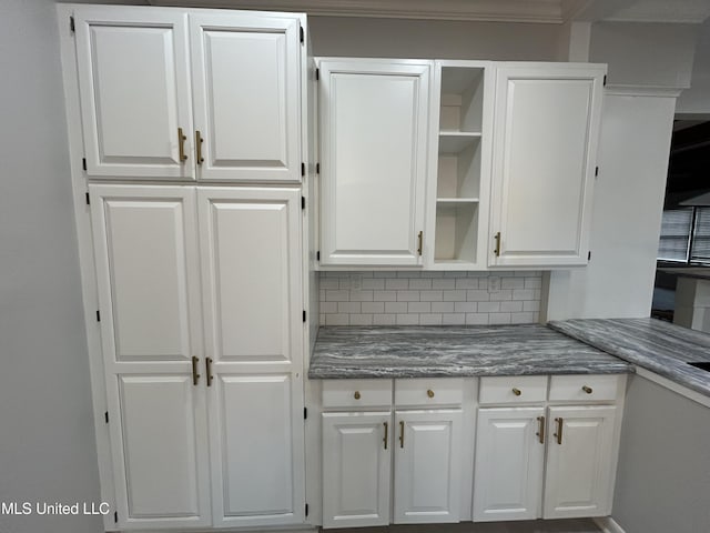 341 N Ruby Ave, Ruleville, MS 38771 - kitchen featuring white cabinetry, tasteful backsplash, and open shelves