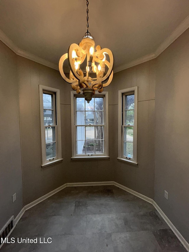 341 N Ruby Ave, Ruleville, MS 38771 - unfurnished dining area featuring baseboards, ornamental molding, visible vents, and a notable chandelier