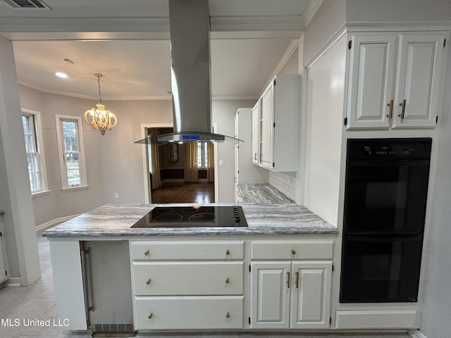 341 N Ruby Ave, Ruleville, MS 38771 - kitchen with white cabinets, ornamental molding, island exhaust hood, and black appliances