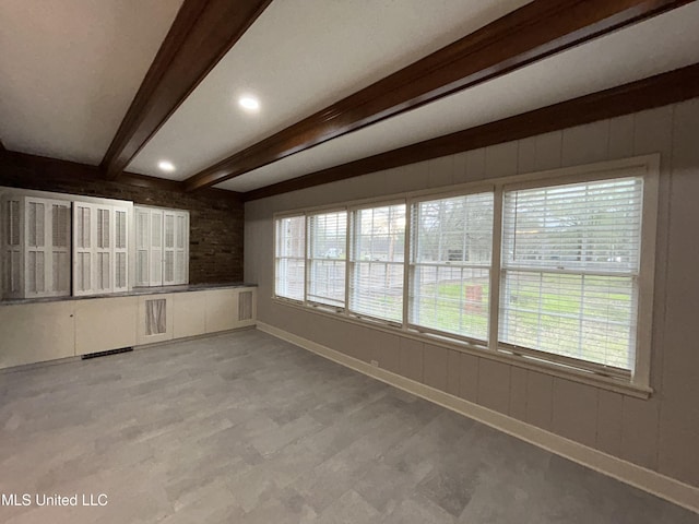 341 N Ruby Ave, Ruleville, MS 38771 - spare room with beam ceiling and baseboards