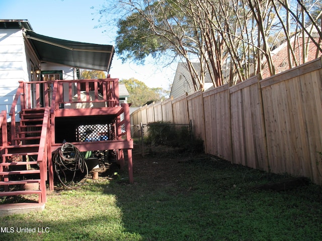 view of yard featuring a wooden deck