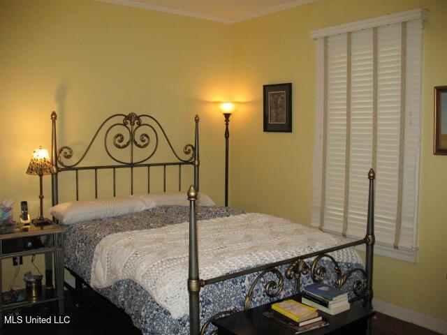 bedroom featuring ornamental molding