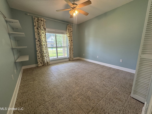 730 Ieke Cir, Diamondhead, MS 39525 - spare room featuring a textured ceiling and a ceiling fan