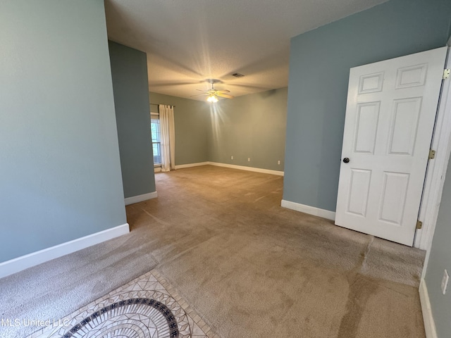 730 Ieke Cir, Diamondhead, MS 39525 - carpeted empty room featuring a ceiling fan and baseboards