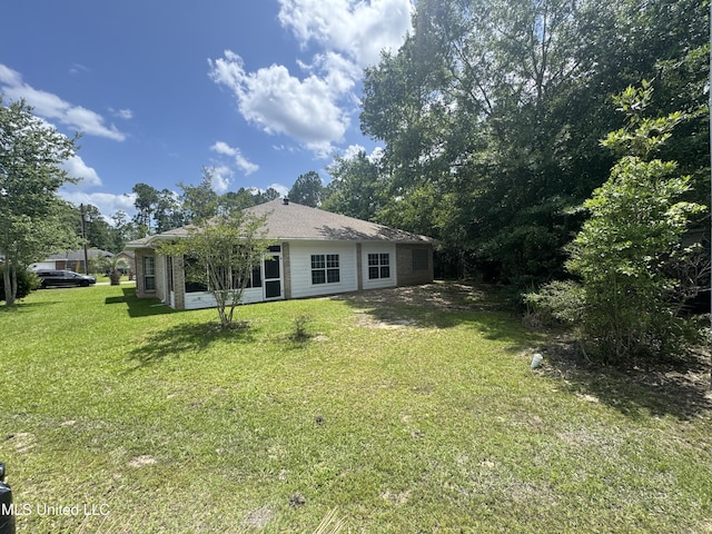 730 Ieke Cir, Diamondhead, MS 39525 - rear view of house with a yard