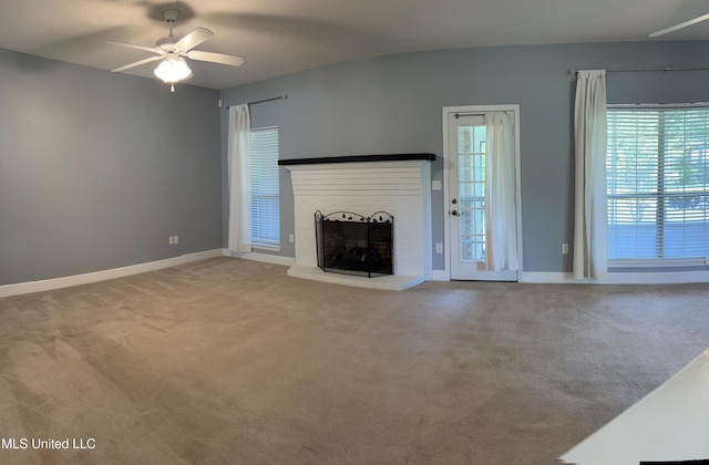 730 Ieke Cir, Diamondhead, MS 39525 - unfurnished living room with ceiling fan, healthy amount of natural light, carpet, and a fireplace