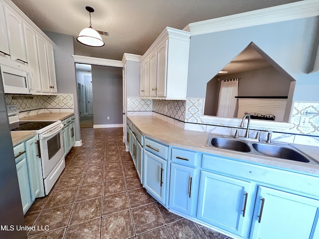 730 Ieke Cir, Diamondhead, MS 39525 - kitchen with white appliances, white cabinetry, backsplash, light countertops, and a textured ceiling