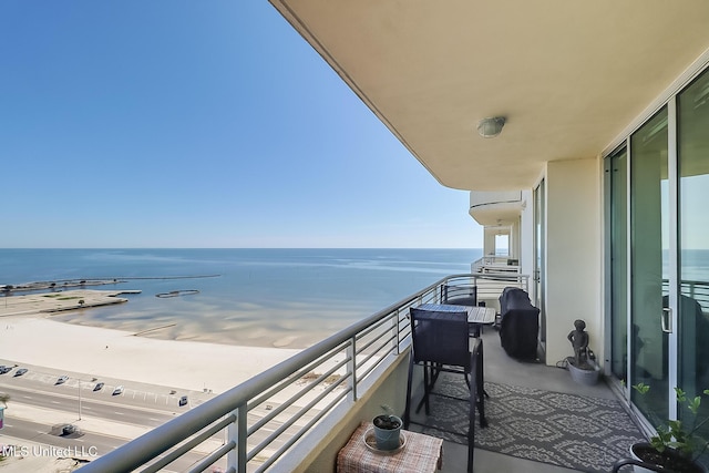 balcony featuring a water view