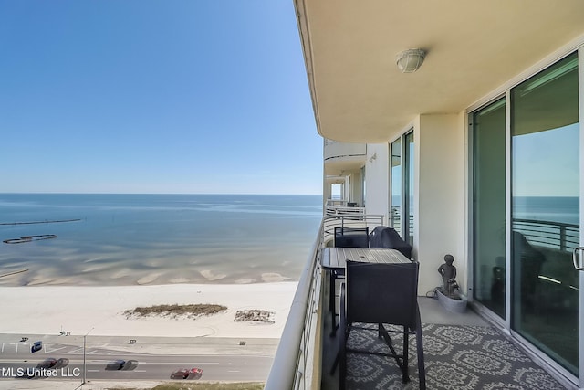 balcony featuring a water view