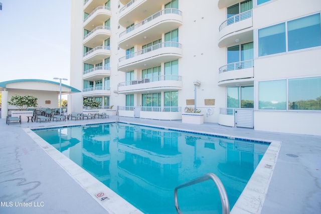 pool with a patio area