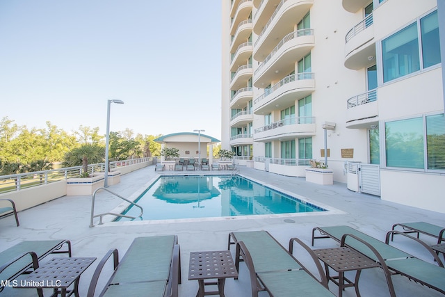 pool featuring a patio