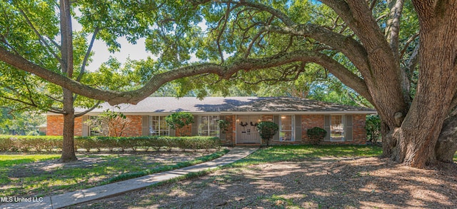 ranch-style house with brick siding