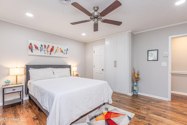 bedroom with recessed lighting, wood finished floors, a ceiling fan, baseboards, and crown molding