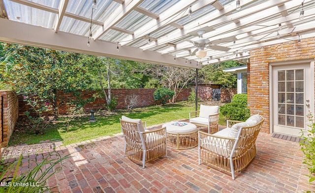 view of patio / terrace featuring a fenced backyard, ceiling fan, an outdoor hangout area, and a pergola