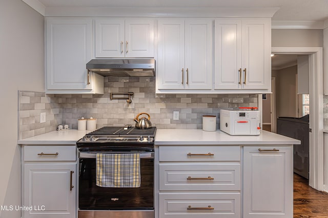 kitchen with under cabinet range hood, white cabinetry, light countertops, and gas stove