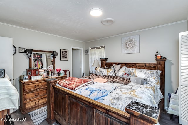 bedroom with wood-type flooring and ornamental molding