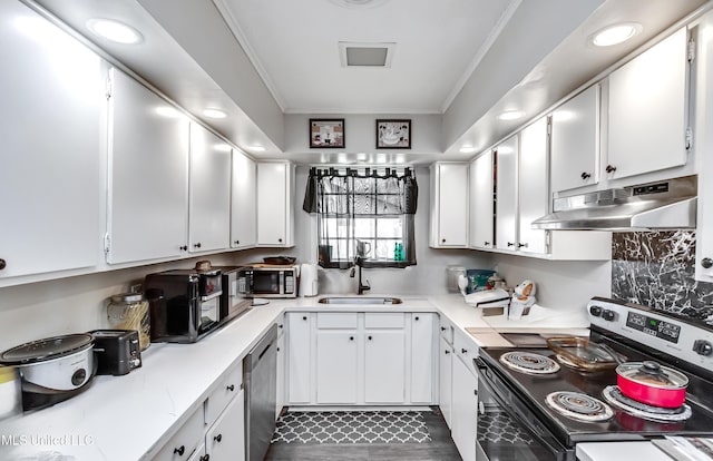 kitchen featuring sink, ornamental molding, white cabinets, and appliances with stainless steel finishes