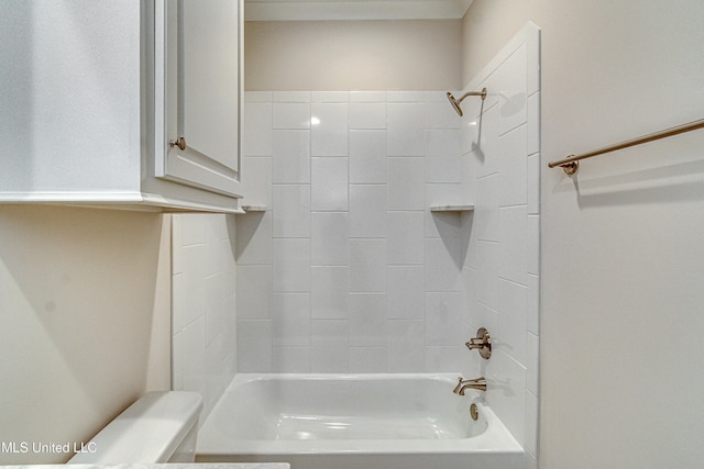 bathroom featuring tiled shower / bath