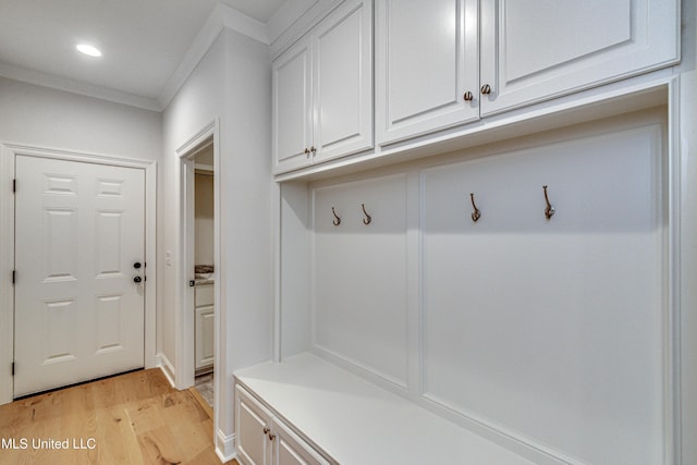 mudroom featuring crown molding and light hardwood / wood-style flooring