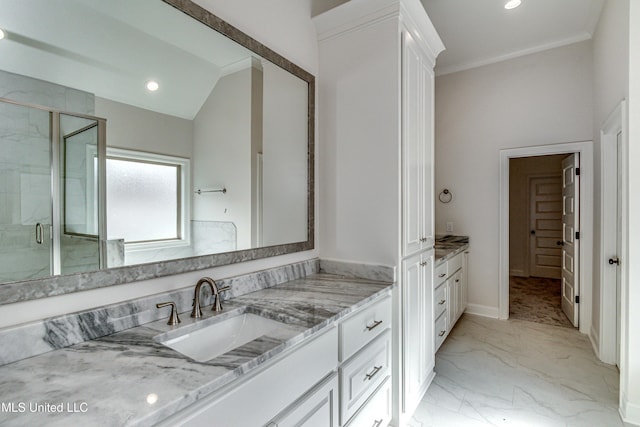 bathroom featuring vanity, vaulted ceiling, an enclosed shower, and crown molding