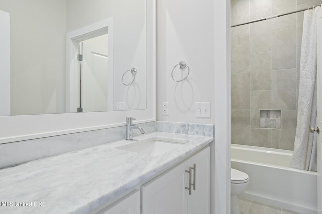 bathroom with vanity, toilet, shower / bath combo, and tile patterned flooring