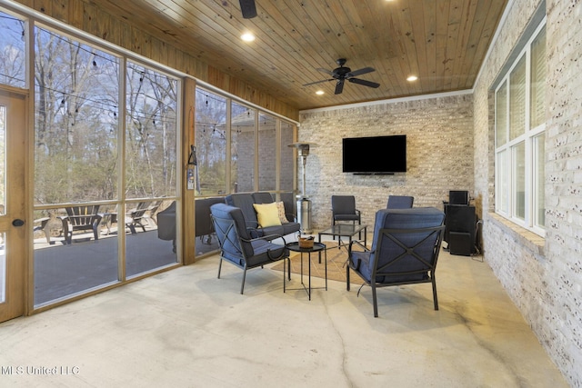 sunroom / solarium with wooden ceiling and ceiling fan