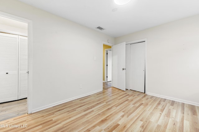 2709 E Angela Cir, Gulfport, MS 39503 - unfurnished bedroom with light hardwood / wood-style floors and a closet
