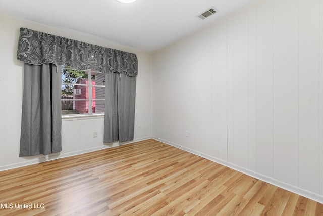 unfurnished room featuring wood-type flooring