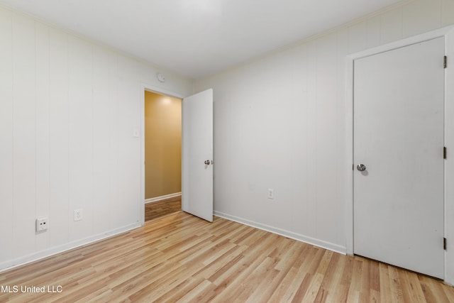 unfurnished bedroom with light wood-type flooring