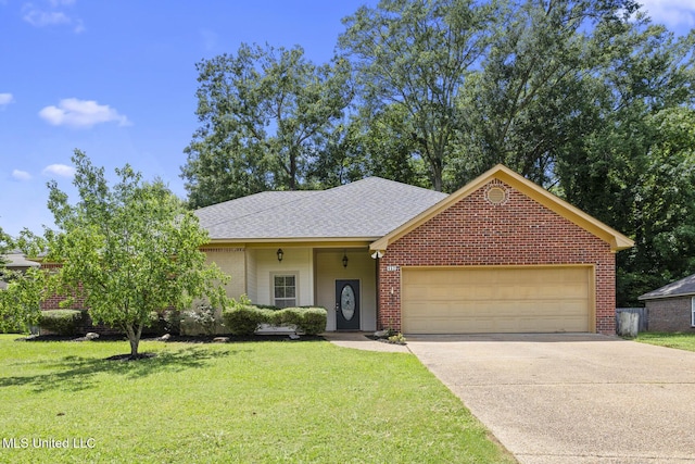 452 Pecan Cir, Brandon, MS 39042 - view of front of home with an attached garage, driveway, brick siding, and a front lawn