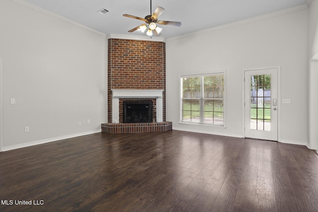 452 Pecan Cir, Brandon, MS 39042 - unfurnished living room featuring ceiling fan, crown molding, a brick fireplace, and wood finished floors