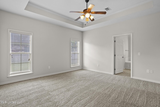 452 Pecan Cir, Brandon, MS 39042 - spare room featuring a raised ceiling, crown molding, carpet flooring, and ceiling fan