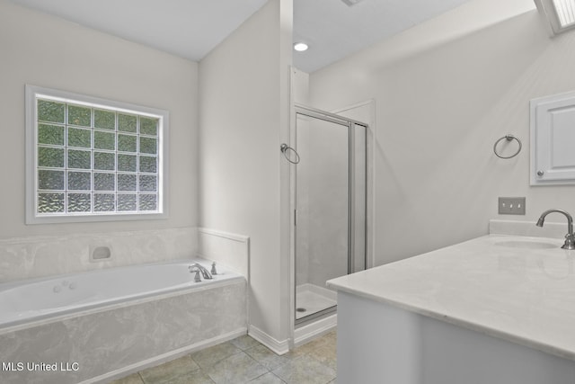 452 Pecan Cir, Brandon, MS 39042 - full bath with vanity, a shower stall, a garden tub, and tile patterned flooring