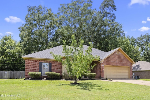 452 Pecan Cir, Brandon, MS 39042 - view of front of home with an attached garage, driveway, brick siding, and a shingled roof