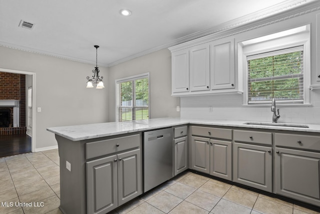 452 Pecan Cir, Brandon, MS 39042 - kitchen with gray cabinetry, stainless steel dishwasher, light tile patterned floors, a peninsula, and crown molding