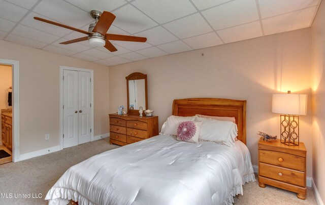 904 Northwood Cir, Brandon, MS 39047 - bedroom featuring a ceiling fan, a closet, a drop ceiling, light colored carpet, and baseboards