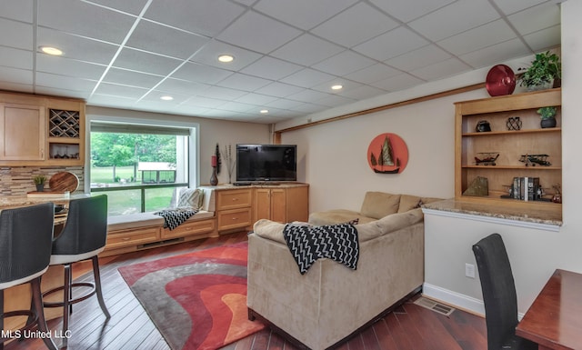 904 Northwood Cir, Brandon, MS 39047 - living room with dark wood-style flooring, a drop ceiling, visible vents, and recessed lighting