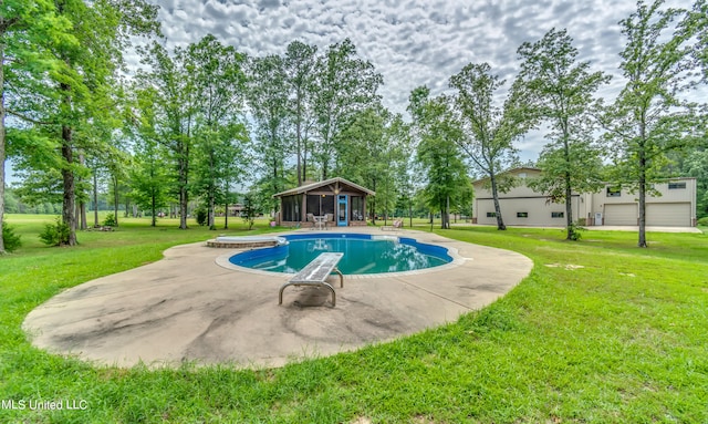 view of pool with a sunroom and a lawn