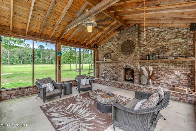 sunroom featuring ceiling fan and vaulted ceiling with beams