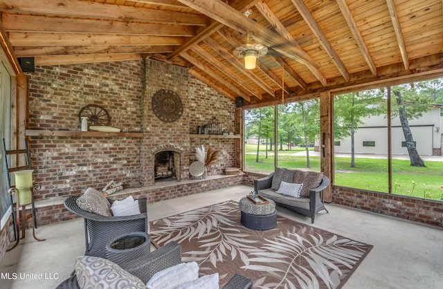 sunroom with vaulted ceiling with beams, wooden ceiling, and ceiling fan