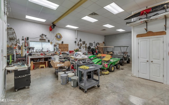 904 Northwood Cir, Brandon, MS 39047 - garage featuring visible vents and a workshop area