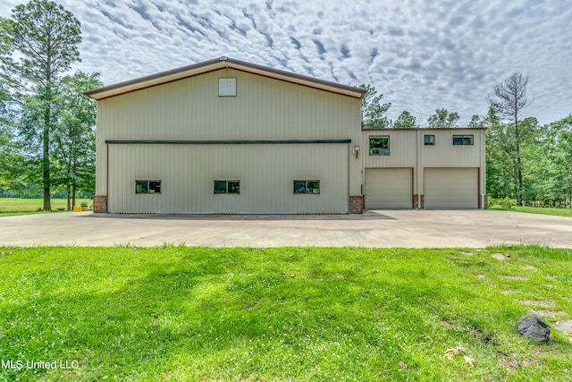 exterior space with a lawn and a garage