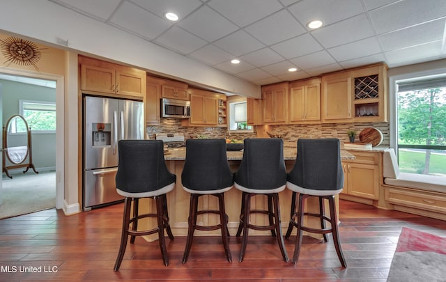 904 Northwood Cir, Brandon, MS 39047 - kitchen featuring light stone counters, open shelves, stainless steel appliances, and dark wood-style floors