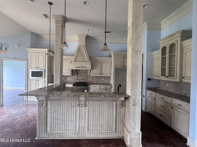 515 Belle Oak Pl, Brandon, MS 39042 - kitchen featuring cream cabinetry, range with gas stovetop, a kitchen bar, ornamental molding, and dark stone counters