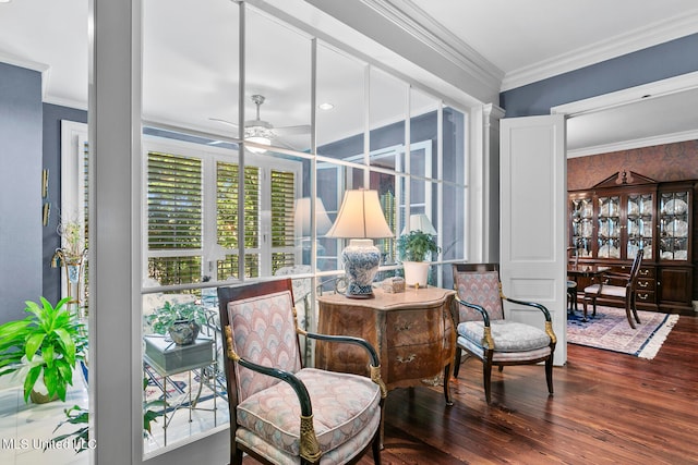 sitting room featuring ornamental molding, hardwood / wood-style flooring, and ceiling fan