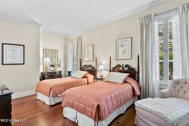 bedroom featuring crown molding and dark hardwood / wood-style floors